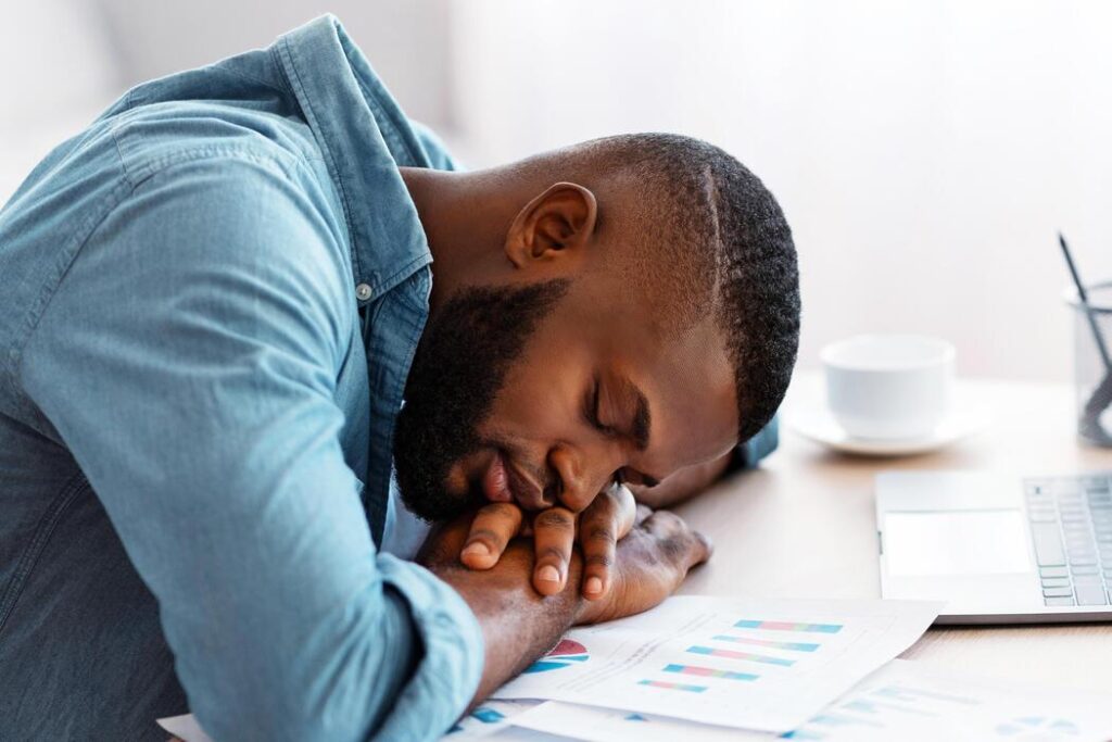 tired worker corporate wellness a necessity